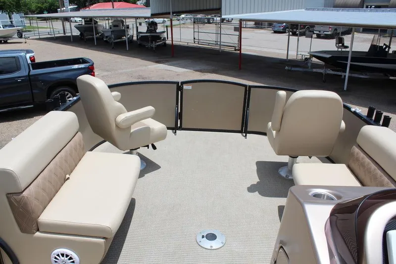 Slide: The Image of 2022 Massimo Marine P-23 TRITOON boat interior with beige seating and spacious deck. - 16