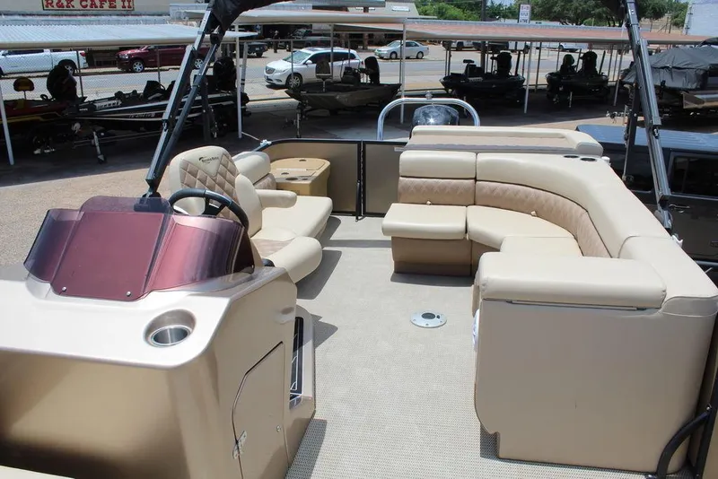 Slide: The Image of 2022 Massimo Marine P-23 TRITOON interior with beige seating and helm. - 7