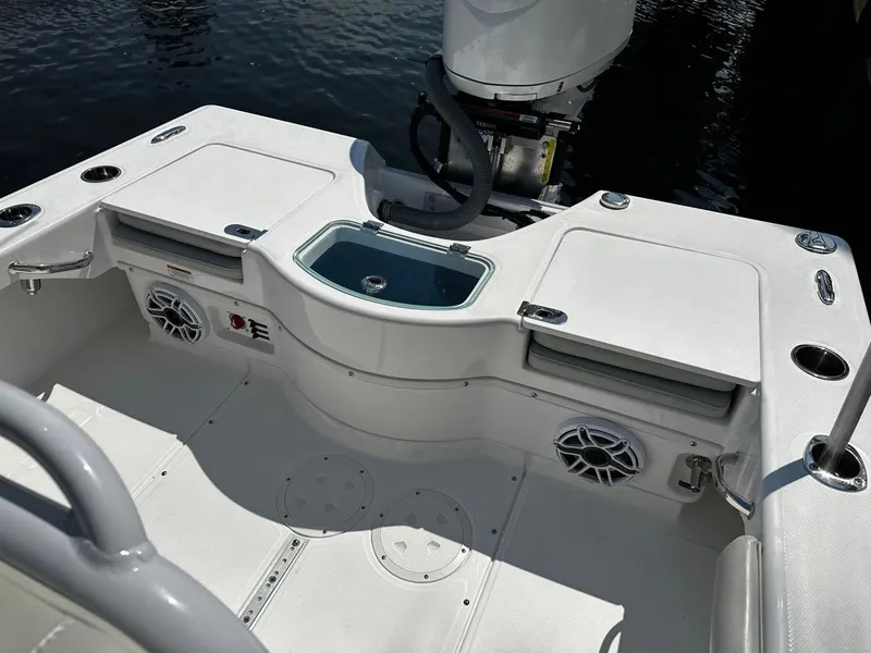 Slide: The Image of 2023 Everglades 243 Center Console boat interior with storage and speakers. - 12
