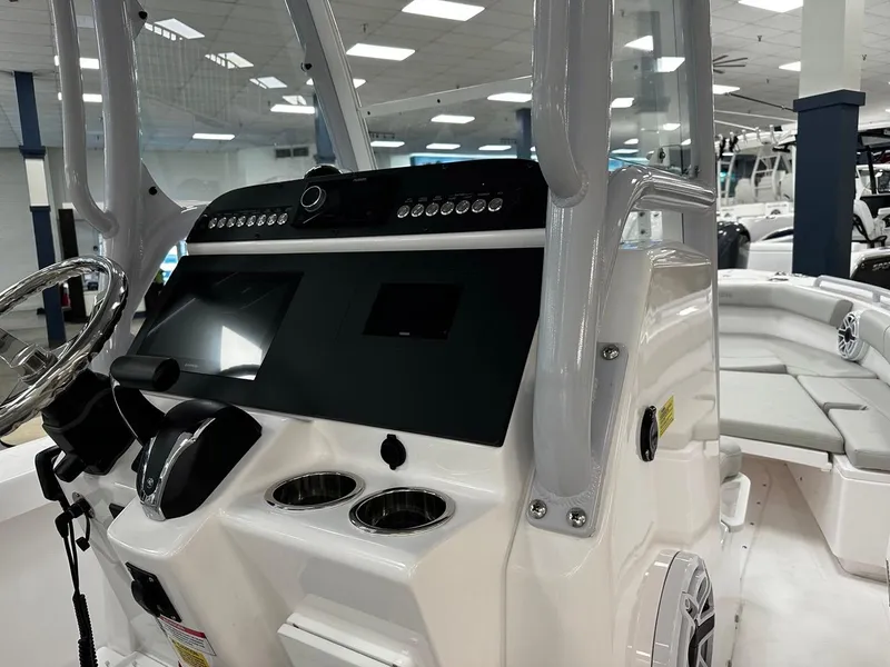 Slide: The Image of 2023 Everglades 243 Center Console boat interior with modern dashboard and seating. - 6