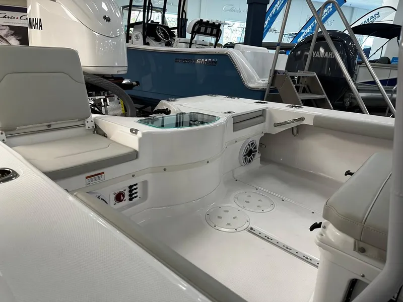 Slide: The Image of 2023 Everglades 243 Center Console boat interior with seating and Yamaha engine. - 7