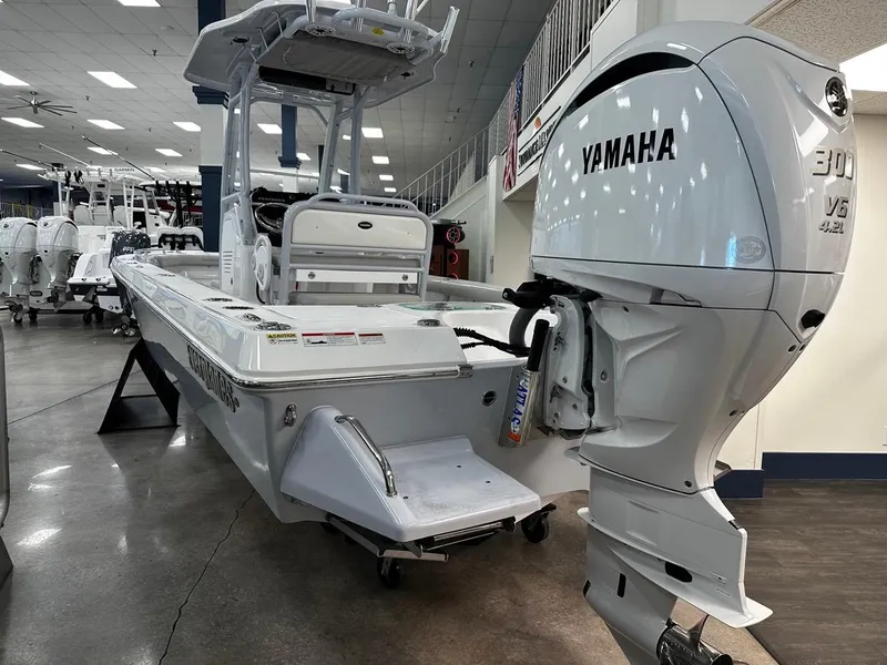 Slide: The Image of 2023 Everglades 243 Center Console boat with Yamaha 300 V6 engine in showroom. - 8