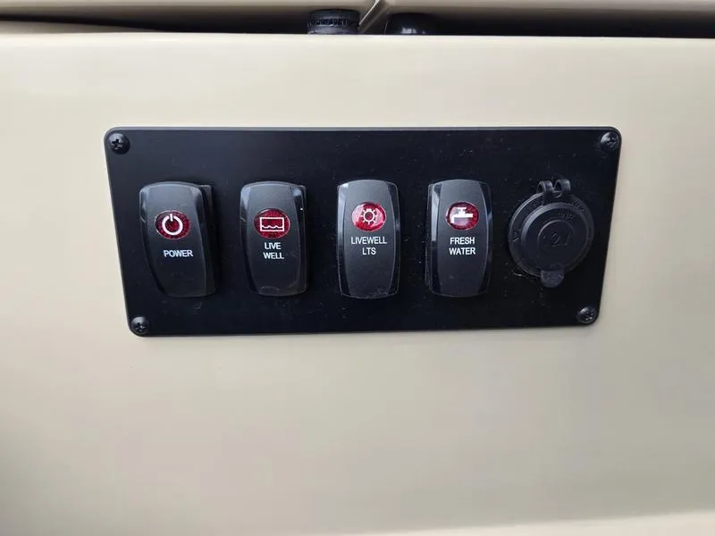 Slide: The Image of Control panel of 2025 Godfrey Sweetwater 2086 FS Sport Tube boat with power and water switches. - 17