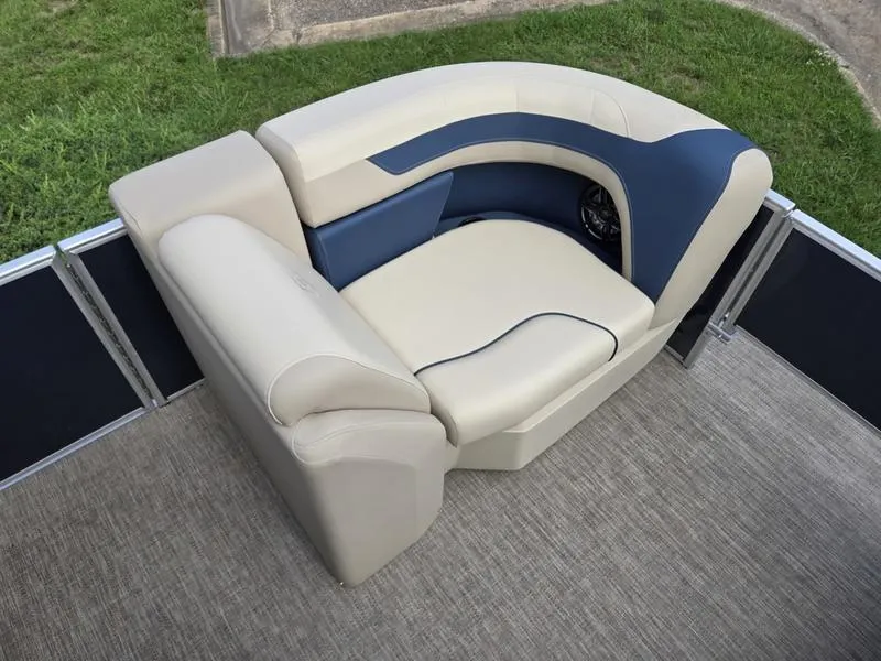 Slide: The Image of Luxurious seating on 2025 Godfrey Sweetwater 2086 FS Sport Tube boat, featuring beige and blue upholstery. - 9