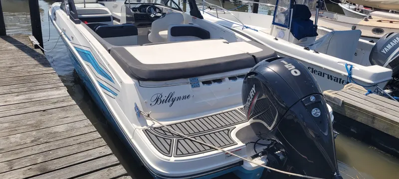 Slide: The Image of 2020 Bayliner VR5 Bowrider OB docked, featuring a sleek design and powerful Mercury outboard engine. - 16