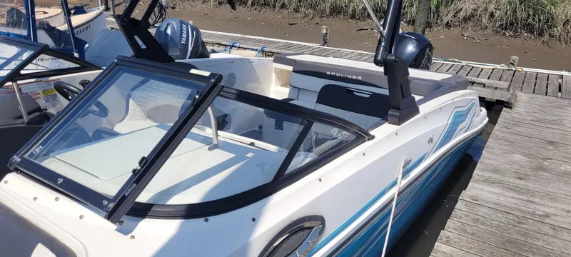 Slide: The Image of 2020 Bayliner VR5 Bowrider OB docked, featuring sleek design and spacious seating. - 17