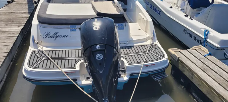Slide: The Image of 2020 Bayliner VR5 Bowrider OB docked, featuring an outboard motor and spacious deck. - 19