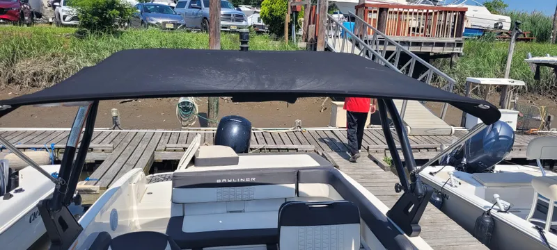 Slide: The Image of Battery compartment of 2020 Bayliner VR5 Bowrider OB boat, showing marine battery and wiring. - 21