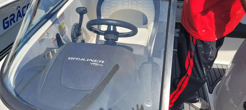 Slide: The Image of 2020 Bayliner VR5 Bowrider OB steering console with windshield and seating. - 22