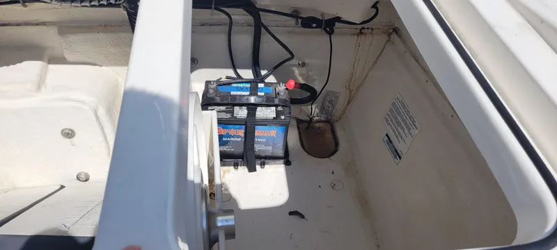 Slide: The Image of 2020 Bayliner VR5 Bowrider OB boat interior with open storage compartment and portable toilet. - 23