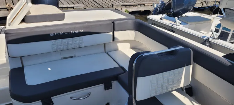 Slide: The Image of 2020 Bayliner VR5 Bowrider OB interior with cushioned seating and sleek design. - 31