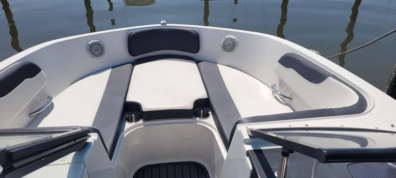 Slide: The Image of 2020 Bayliner VR5 Bowrider OB interior with cushioned seating and cup holders. - 33