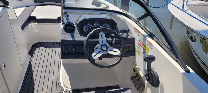 Slide: The Image of 2020 Bayliner VR5 Bowrider OB cockpit with steering wheel and control panel. - 35