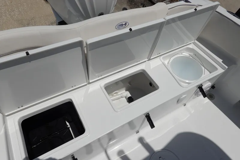 Slide: The Image of 2026 Sea Hunt Ultra 235 SE boat storage compartments and livewell. - 10