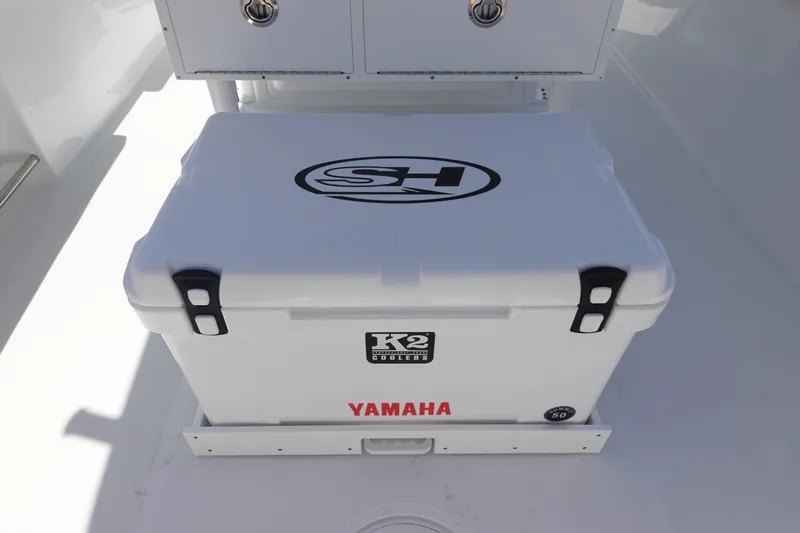 Slide: The Image of White K2 cooler on 2026 Sea Hunt Ultra 235 SE boat deck. - 12