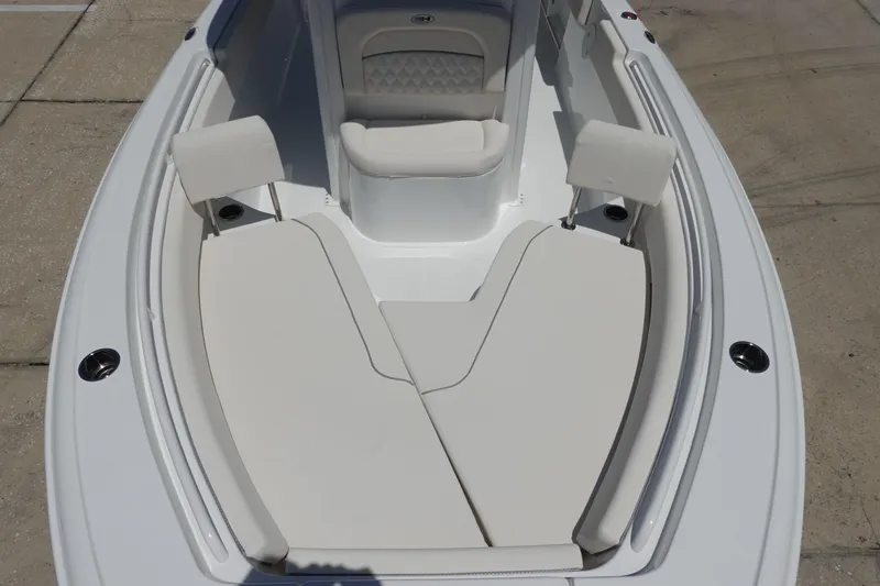 Slide: The Image of 2026 Sea Hunt Ultra 235 SE boat interior with cushioned seating and sleek design. - 29