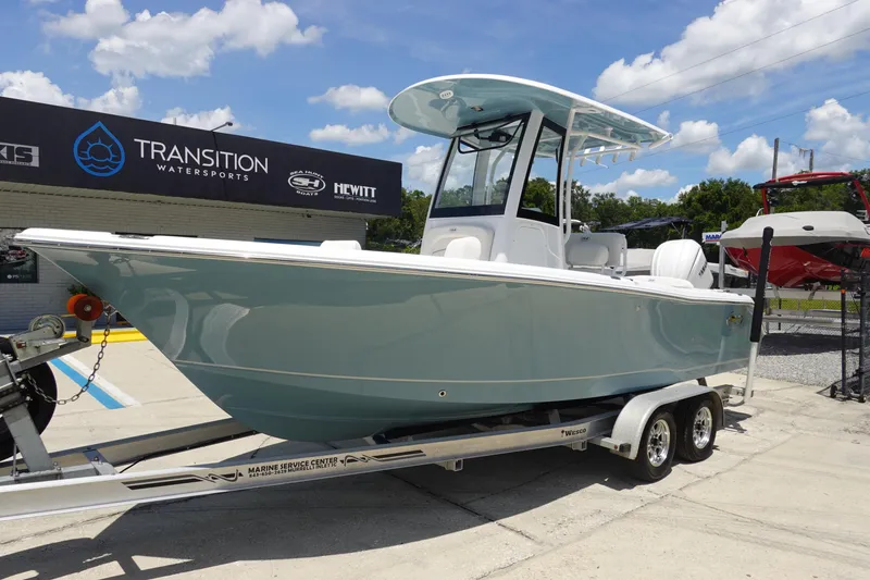 Slide: The Image of 2026 Sea Hunt Ultra 235 SE boat on trailer at Transition Watersports dealership. - 3