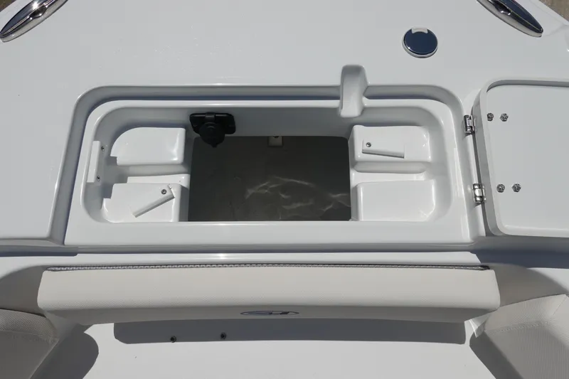 Slide: The Image of Open storage compartment on 2026 Sea Hunt Ultra 235 SE boat. - 33