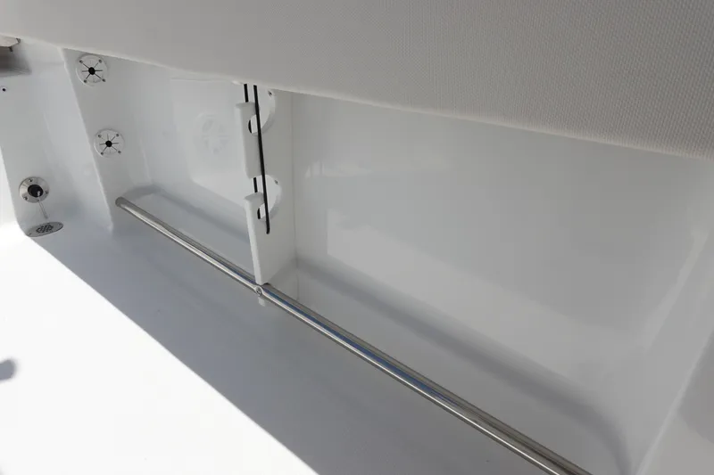 Slide: The Image of 2026 Sea Hunt Ultra 235 SE interior detail with stainless steel railing and white finish. - 37