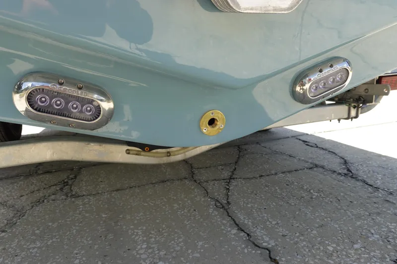 Slide: The Image of Rear view of 2026 Sea Hunt Ultra 235 SE boat with LED lights. - 41