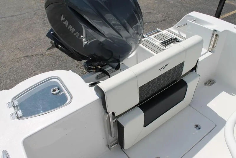 Slide: The Image of 2025 Tidewater 210 CC Adventure boat interior with Yamaha engine and seating. - 12
