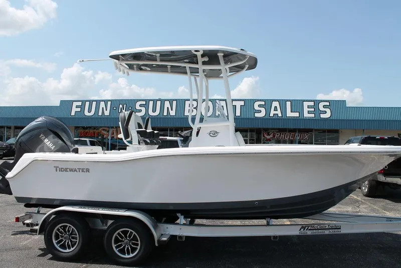 Slide: The Image of 2025 Tidewater 210 CC Adventure boat on trailer at Fun-N-Sun Boat Sales. - 2