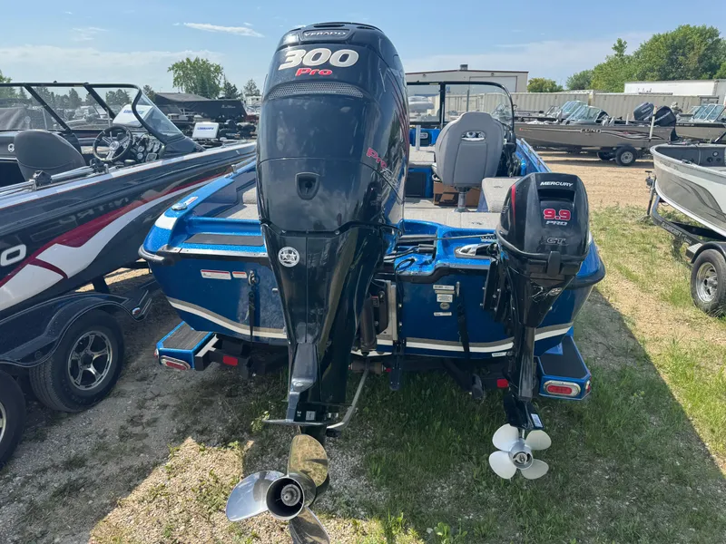 Slide: The Image of 2018 Nitro ZV21 boat with dual Mercury outboard motors in a dealership lot. - 4