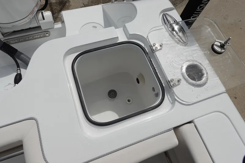 Slide: The Image of 2026 Sea Hunt Gamefish 25 boat interior with livewell and fishing equipment. - 10