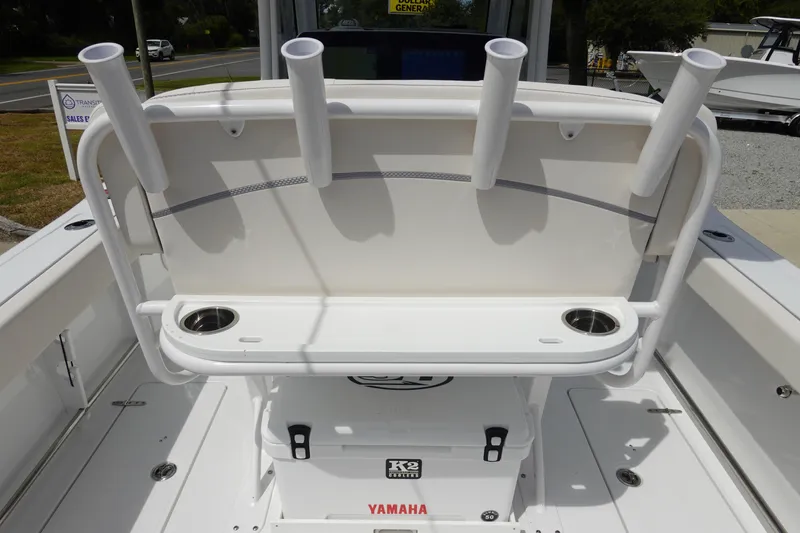 Slide: The Image of 2026 Sea Hunt Gamefish 25 boat interior with rod holders and cup holders. - 11