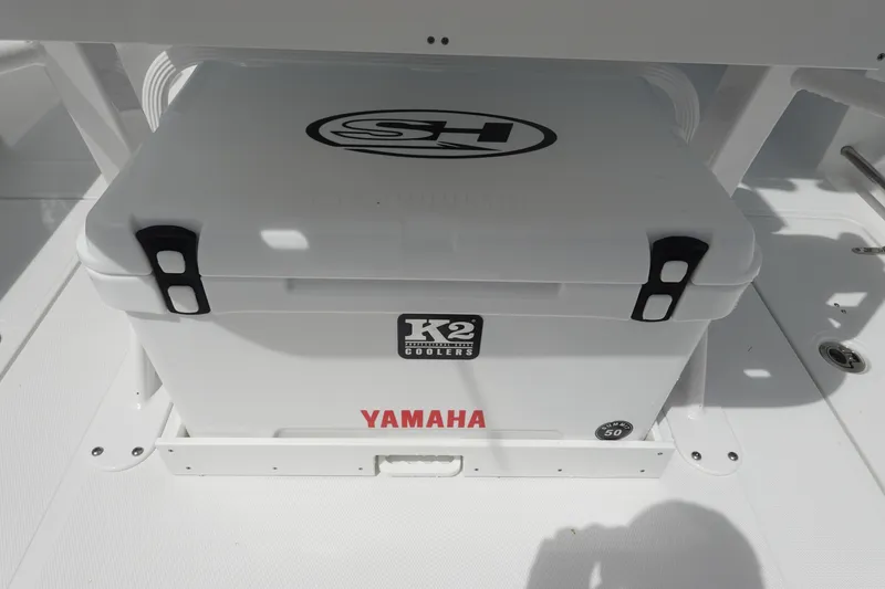 Slide: The Image of 2026 Sea Hunt Gamefish 25 boat with K2 cooler and Yamaha branding. - 12