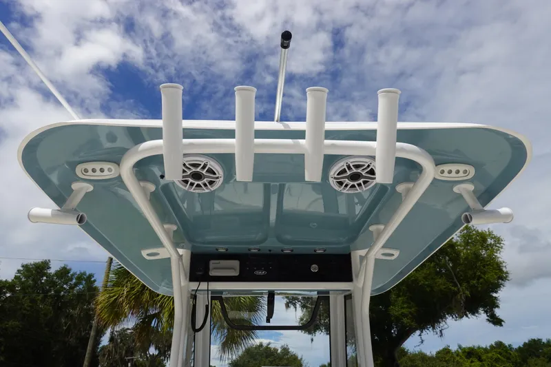 Slide: The Image of 2026 Sea Hunt Gamefish 25 boat top view with rod holders and speakers. - 13