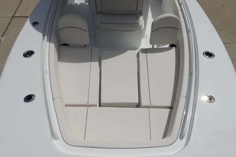 Slide: The Image of 2026 Sea Hunt Gamefish 25 boat interior with cushioned seating and sleek design. - 25