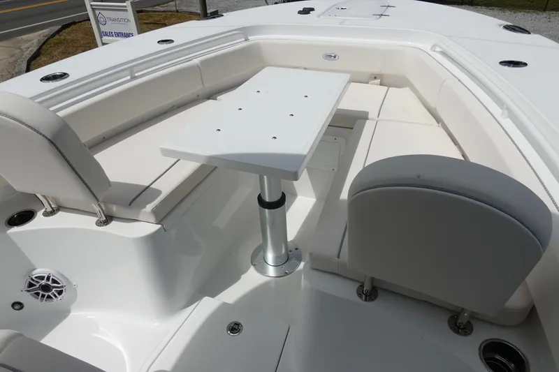 Slide: The Image of 2026 Sea Hunt Gamefish 25 boat interior with seating and table setup. - 26