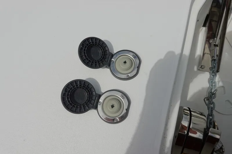 Slide: The Image of Fuel caps on a 2026 Sea Hunt Gamefish 25 boat deck. - 32