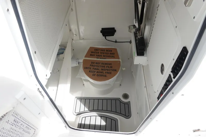 Slide: The Image of Interior of 2026 Sea Hunt Gamefish 25 boat, featuring a compact, well-organized storage area. - 34