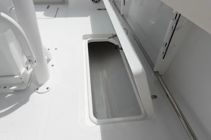 Slide: The Image of 2026 Sea Hunt Gamefish 25 boat storage compartment, open and empty. - 37