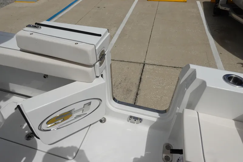 Slide: The Image of 2026 Sea Hunt Gamefish 25 boat interior with seating and storage compartment. - 39
