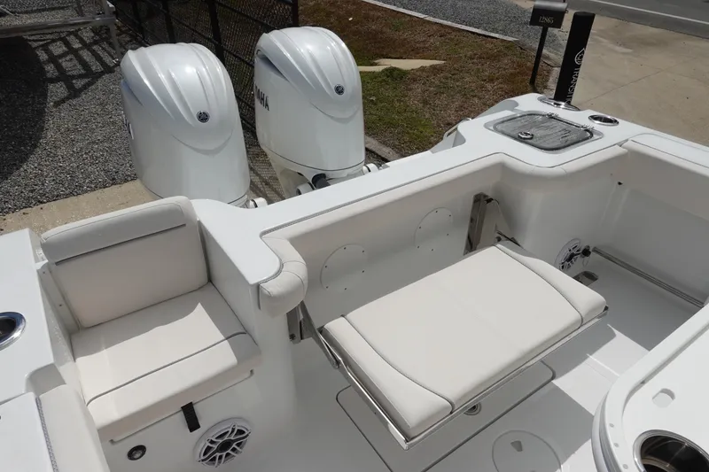 Slide: The Image of 2026 Sea Hunt Gamefish 25 boat interior with dual Yamaha engines and seating area. - 8