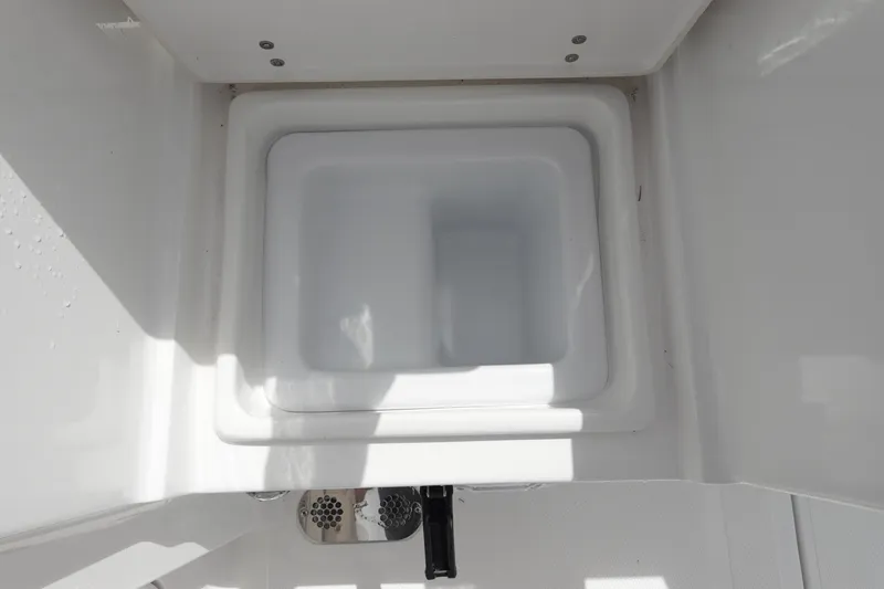 Slide: The Image of 2026 Sea Hunt Gamefish 25 boat storage compartment, white interior, top view. - 9