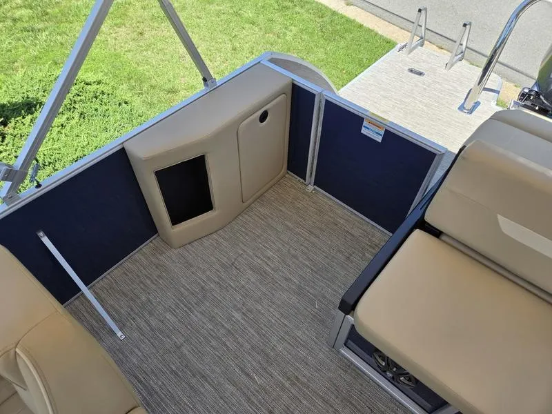 Slide: The Image of 2025 Godfrey Xperience 2286 SFLX Sport Tube interior with beige seating and carpeted flooring. - 17