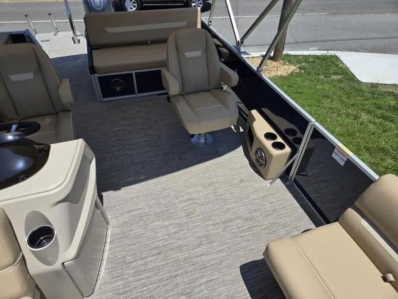Slide: The Image of 2025 Godfrey Xperience 2286 SFLX boat interior with beige seating and modern amenities. - 7