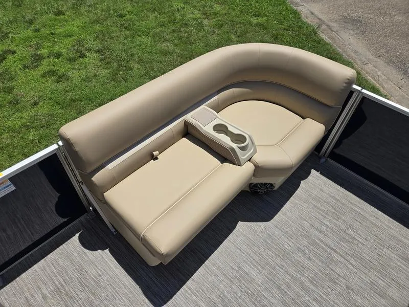 Slide: The Image of 2025 Godfrey Xperience 2286 SFLX Sport Tube boat seating with beige upholstery and cup holders. - 9