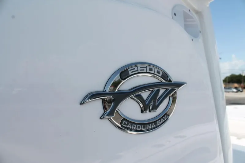 Slide: The Image of 2025 Tidewater 2500 CB Carolina Bay logo on white boat exterior. - 11