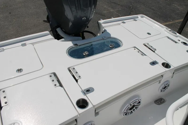 Slide: The Image of 2025 Tidewater 2500 CB boat deck with storage compartments and motor. - 12
