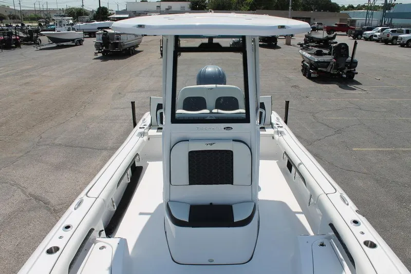 Slide: The Image of 2025 Tidewater 2500 CB boat, white interior, parked in a lot with other boats. - 15