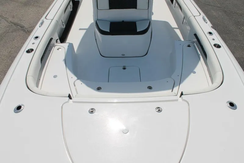 Slide: The Image of 2025 Tidewater 2500 CB boat interior, featuring sleek white seating and deck design. - 17