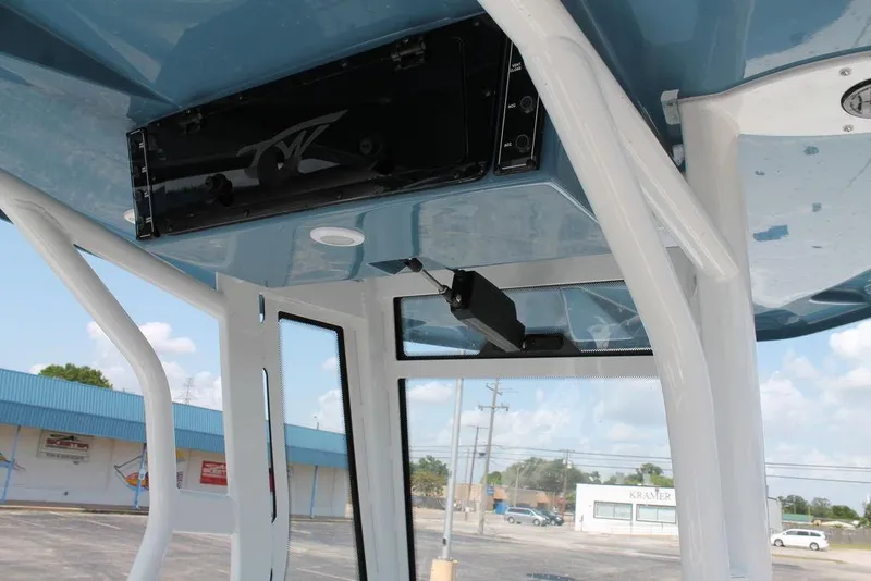 Slide: The Image of 2025 Tidewater 2500 CB boat interior with blue ceiling and white frame. - 7