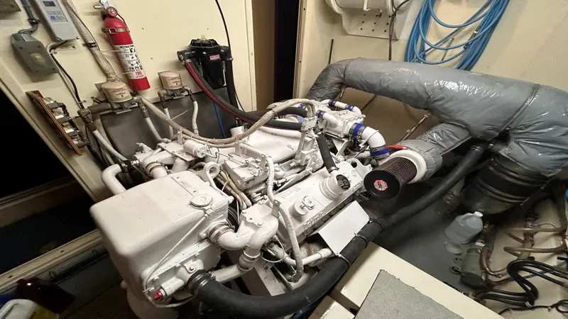 Slide: The Image of Engine room of 1987 Hatteras 58 Motor Yacht with visible machinery and equipment. - 12
