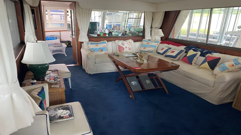 Slide: The Image of Interior of 1987 Hatteras 58 Motor Yacht with cozy seating and nautical decor. - 3