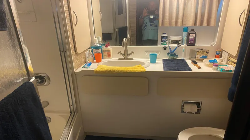 Slide: The Image of Bathroom interior of 1987 Hatteras 58 Motor Yacht with toiletries and shower. - 9